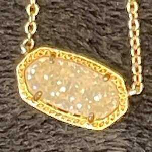 Kendra Scott gold and crushed crystal necklace.